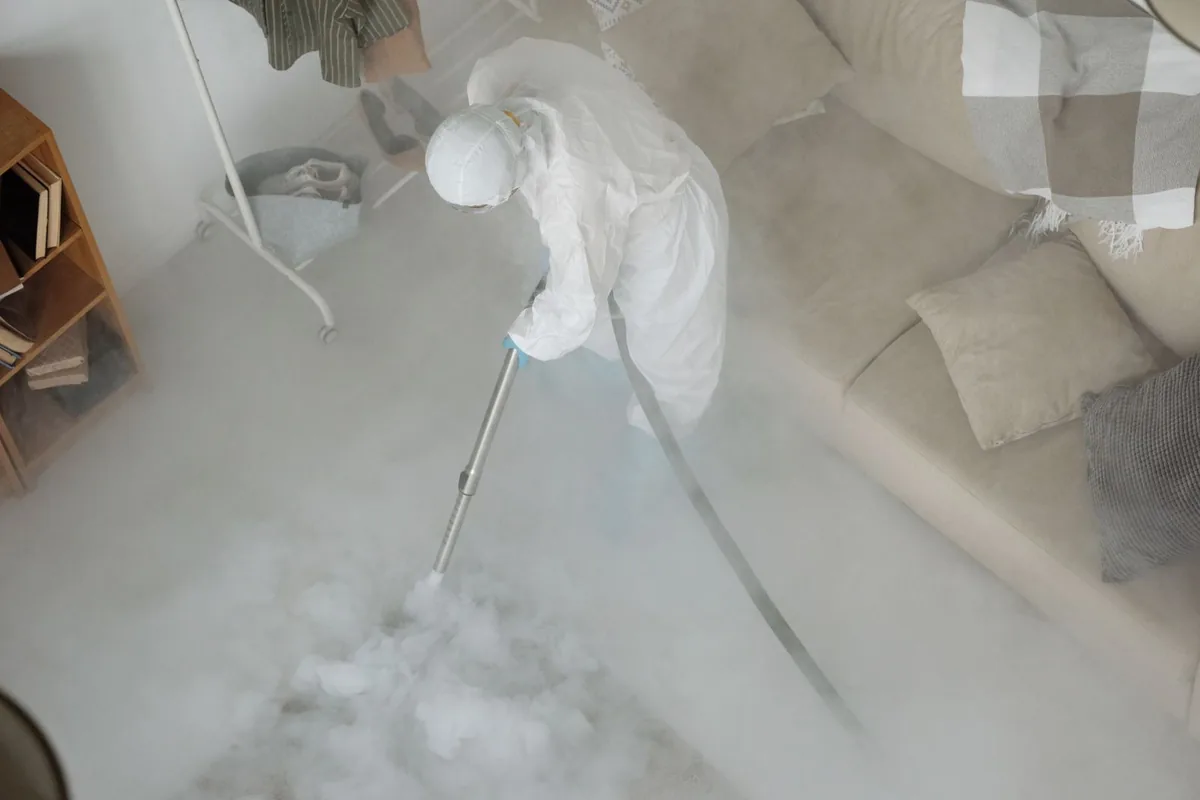 Biohazard cleanup technician in protective equipment, Stapleton, AL